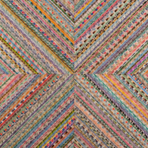 A photo of a mixed-media art piece. Rows of old postage stamps are arranged in groups of 4 squares, each turned at 45 degrees to one another so the overall shape is a giant x or otherwise a squared cross turned at 45 degrees. The colors of the rows of stamps are warm yellows, purple, darke purple, blue, light red that give the image an overall wam color effect.