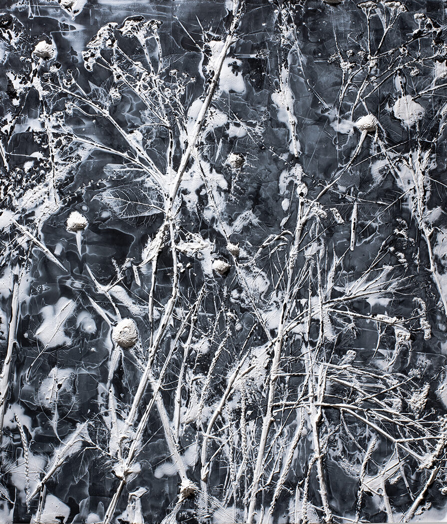 An painting in black and white tones composed of imagery of leaves, stems of bushes, and snowy white spots that is arranged among brush strokes and streaks of paint in a manner that makes it look like a large abstract drip piece.