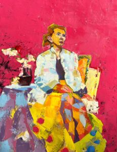 A stylized, impressionist painting of a woman seated against a pink background, wearing a bright, large-pattern dress near a table while holding a dog