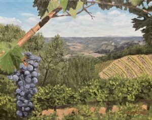 A mountain vineyard painting with a closeup of grapes and vine branches in the foreground on a bright, sunny day with light clouds in the distance