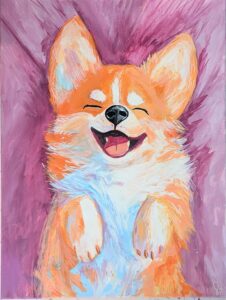 A small brown dog with big ears laying back and smiling